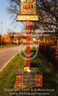 Southern side of the Foulsham Village Sign and Memorial Plaques, 1995, with flowers left in memory of lost aircrew by A.A.Newstead on behalf of Anderson's Crew, 462 Squadron.