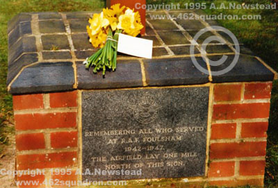 Close up of the southern side of the Foulsham Village Sign and Memorial Plaques, 1995, with flowers left in memory of lost aircrew by A.A.Newstead, on behalf of Anderson's Crew, 462 Squadron.