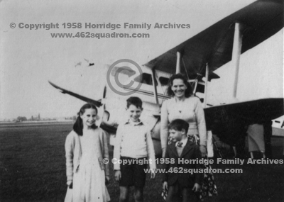 Myra Horridge and children with de Havilland biplane at Elmdon, 1958.